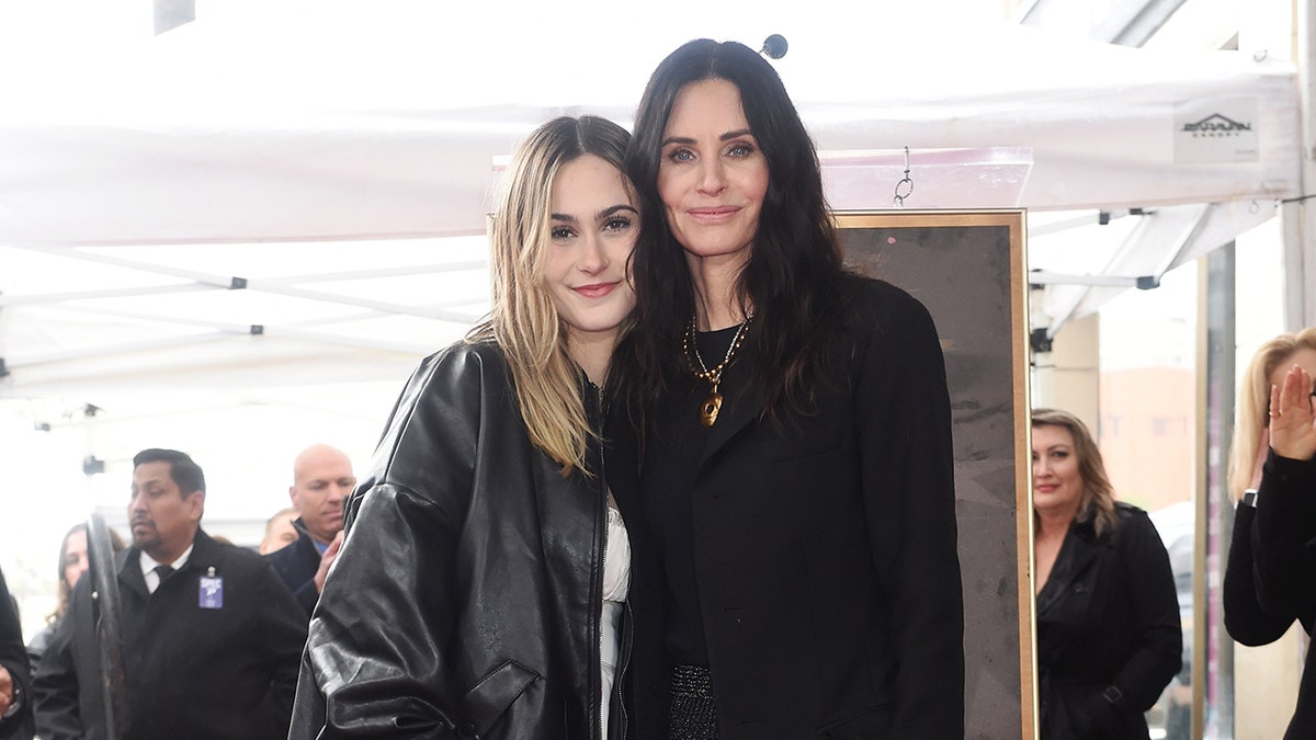 Coco Arquette and Courteney Cox posing together
